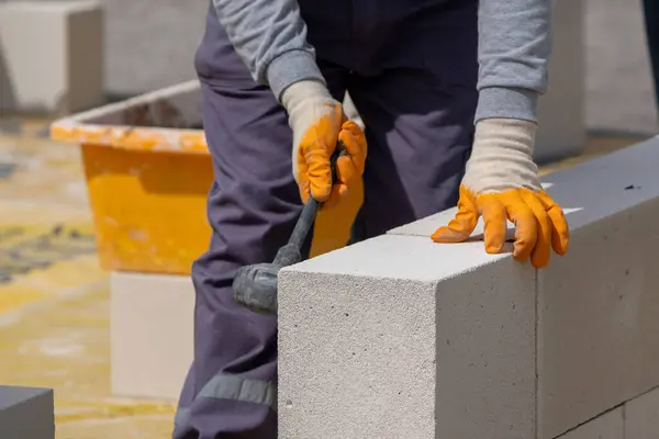 bricklayer working building wall aerated